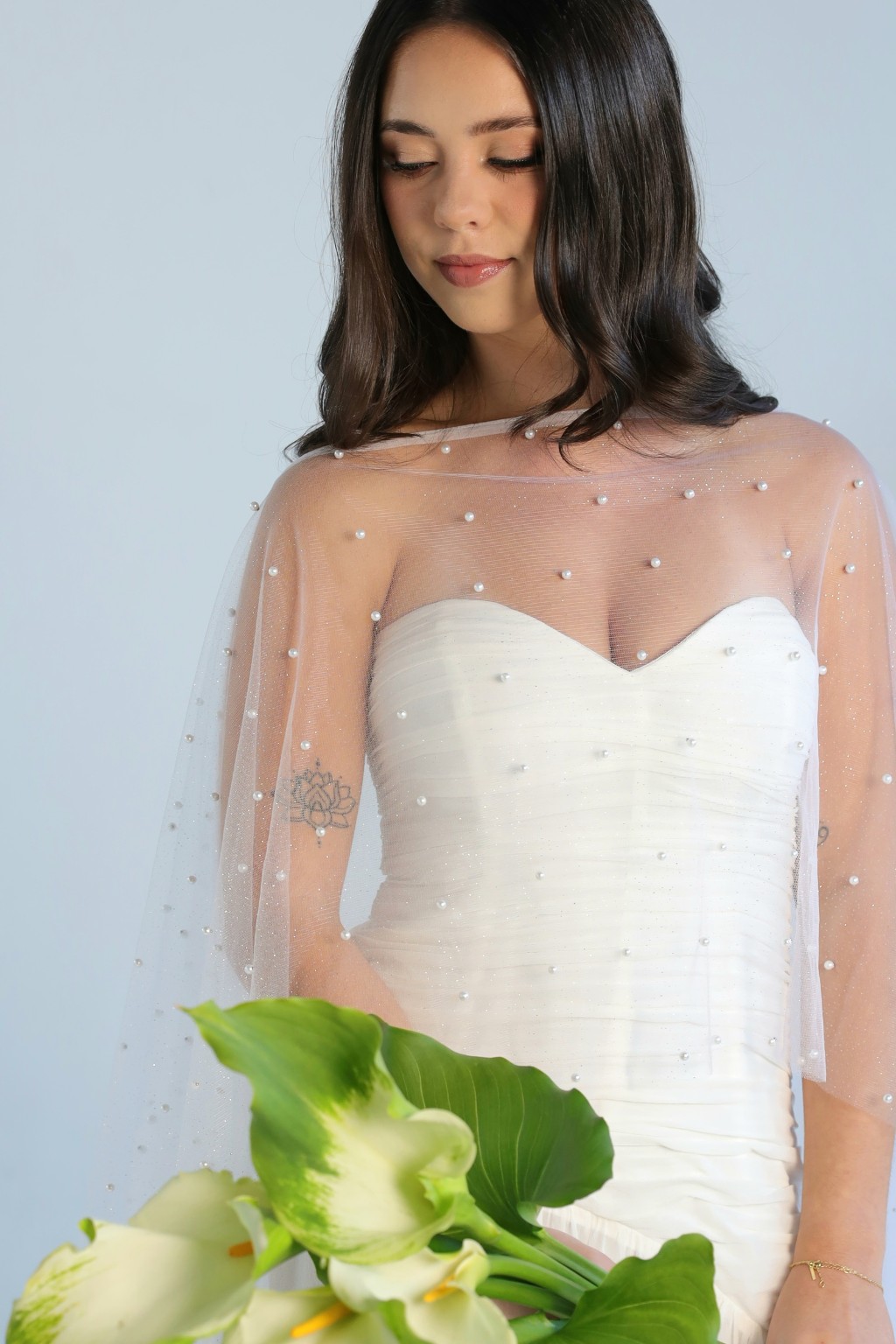 Pearl veil with pearl embellishments over Elara bridal dress, close-up